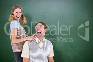 Composite image of excited geeky hipster couple