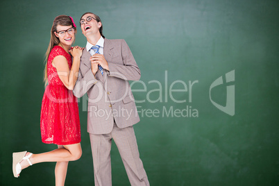 Composite image of hipster couple having fun together