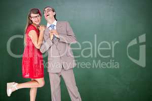 Composite image of hipster couple having fun together