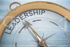 Composite image of compass pointing to leadership