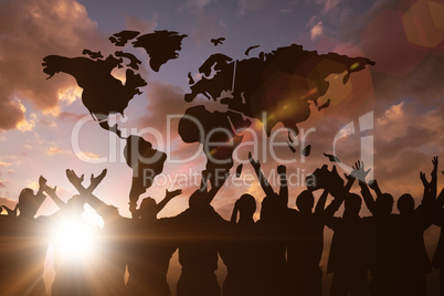 Composite image of silhouetters celebrating