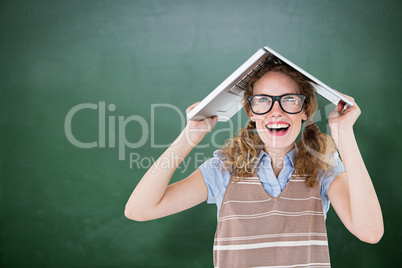 Composite image of geeky hipster woman covering her head with he