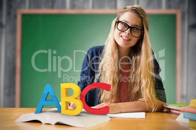 Composite image of student studying in the library