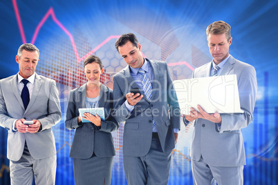 Composite image of business colleagues using their multimedia de