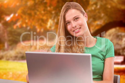 Composite image of student on laptop