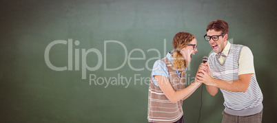 Composite image of geeky hipster couple singing into a microphon