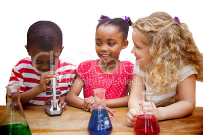 Composite image of cute pupil looking through microscope