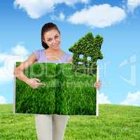 Composite image of woman pointing lawn book