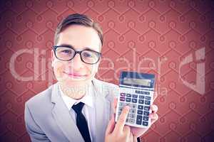 Composite image of geeky smiling businessman showing calculator