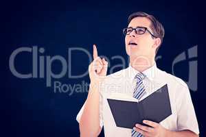 Composite image of geeky businessman reading from book