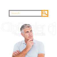 Composite image of casual man thinking with hand on chin