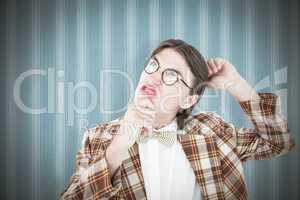 Composite image of geeky hipster scratching his head