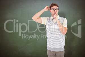 Composite image of geeky hipster thinking with hand on chin