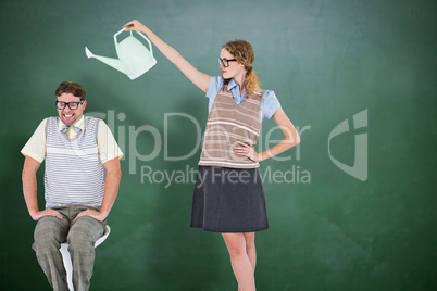 Composite image of geeky hipster holding watering can above her