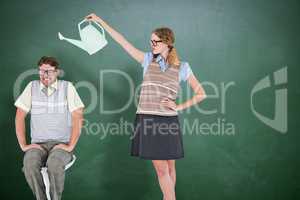 Composite image of geeky hipster holding watering can above her