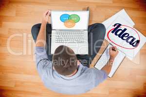 Ideas  against young creative businessman working on laptop