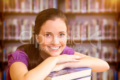 Composite image of portrait of female student in library