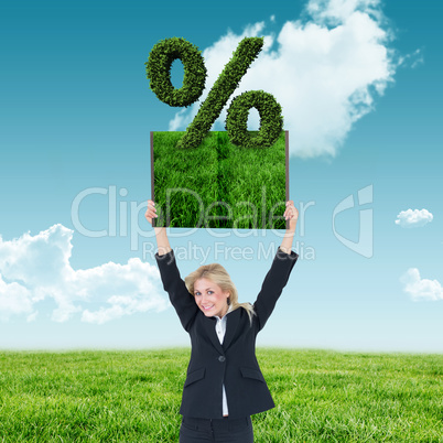 Composite image of woman holding up lawn book