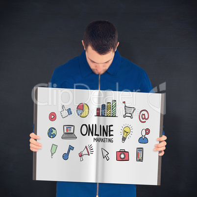 Composite image of manual worker showing a book