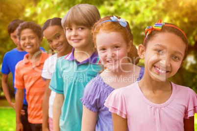 Composite image of smiling pupils in classroom