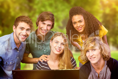 Composite image of college students using computer