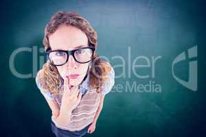 Composite image of geeky hipster woman thinking with hand on chi