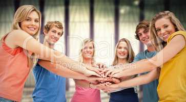 Composite image of low angle shot of friends smiling and looking