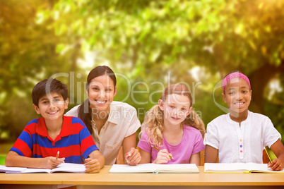 Composite image of pretty teacher helping pupils in library