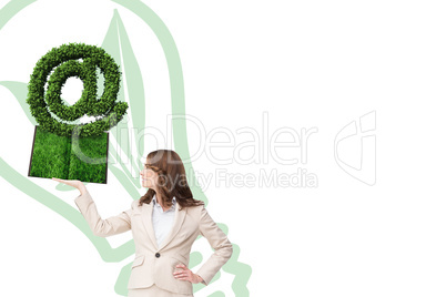 Composite image of woman holding lawn book