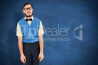 Composite image of geeky hipster pulling a silly face