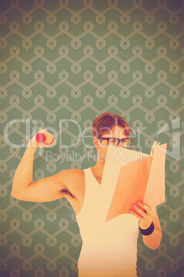 Composite image of geeky hipster lifting dumbbells and reading n