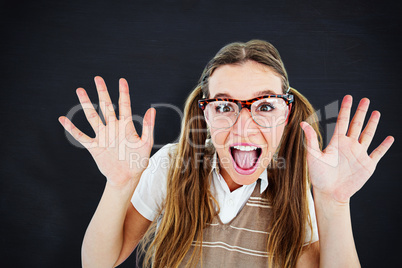 Composite image of female geeky hipster smiling at camera