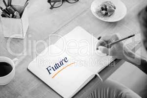 Future against man writing notes on diary