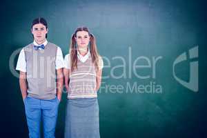 Composite image of unsmiling geeky hipsters looking at camera