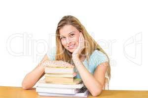 Composite image of portrait of female student in library