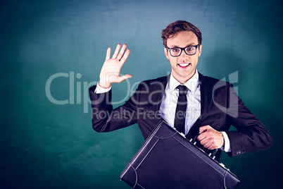 Composite image of young geeky businessman holding briefcase