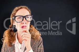 Composite image of geeky hipster woman thinking with hand on chi