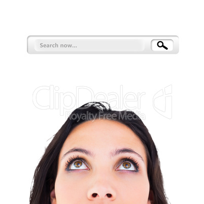 Composite image of pretty brunette looking up thoughfully