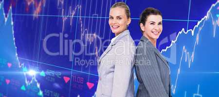 Composite image of attractive businesswomen standing back-to-bac