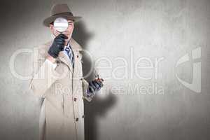 Composite image of spy looking through magnifier