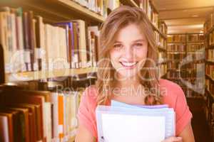 Composite image of smiling hipster holding notebook