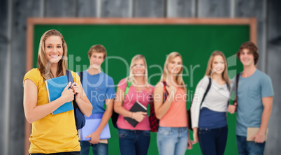 Composite image of a group of college students standing as one g