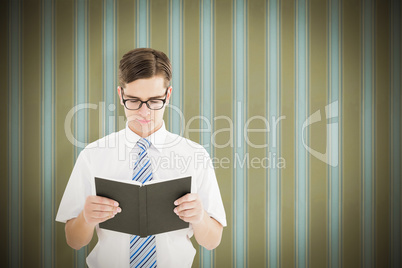 Composite image of geeky businessman reading from book