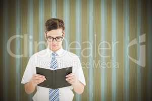 Composite image of geeky businessman reading from book