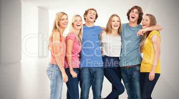 Composite image of full length of a group laughing together and