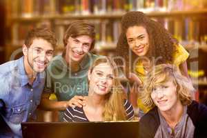 Composite image of college students using computer