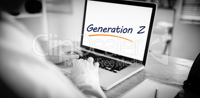 Generation z against businessman working on his laptop