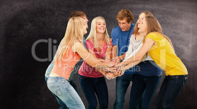 Composite image of group of friends about to cheer with their ha