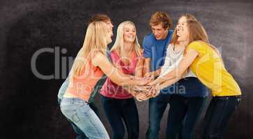 Composite image of group of friends about to cheer with their ha