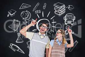 Composite image of happy geeky hipster couple pointing up